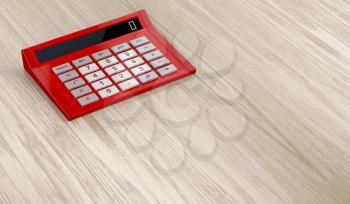 Red calculator on wooden table 