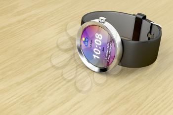 Silver smart watch on wooden table