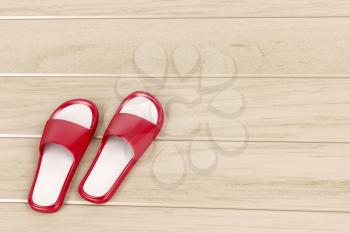 Red slippers on wooden floor