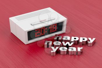 Concept image with digital alarm clock with number 2018 on the display and happy new year message