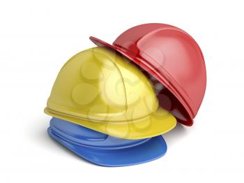 Red, yellow and blue safety helmets on white background