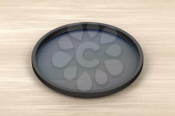 Neutral density photographic filter on wood background