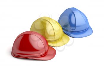 Three safety helmets with different colors on white background