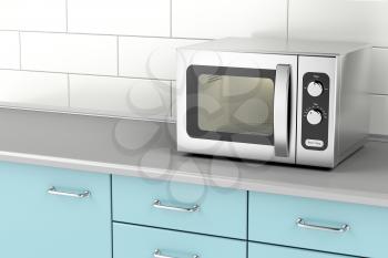 Silver microwave oven in the kitchen 
