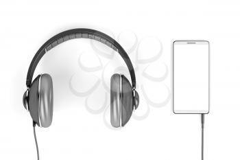 Big wired headphones and smartphone with blank white display, top view