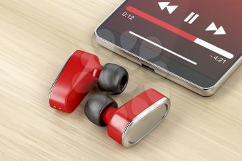 Red wireless headphones and smartphone on wood table 