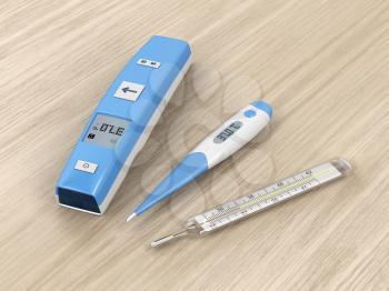 Different types of medical thermometers on wood background