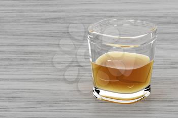 Glass of whisky, brandy or other alcoholic drink on wooden table