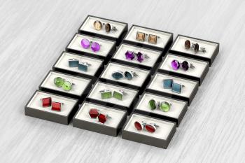 Rows of different designs of cufflinks