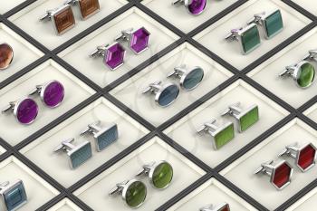 Rows with different designs of cufflinks 
