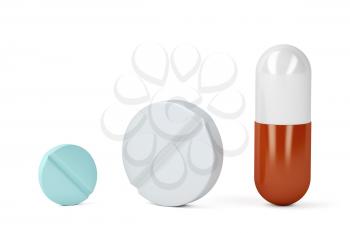 Pills and a capsule on white background