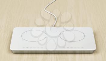 White induction cooktop on wood table