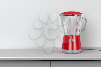 Red electric blender in the kitchen
