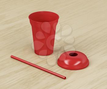 Red disposable plastic cup for cold drinks with a straw on wood background