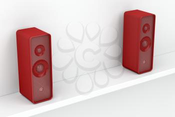 Red stereo speakers on white shelf