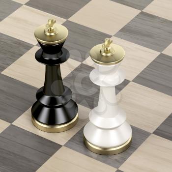 Black and white chess kings on wooden chessboard