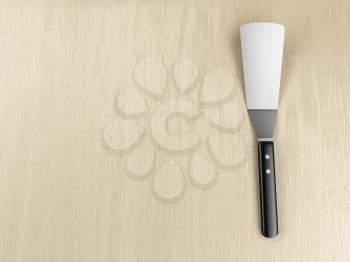 Kitchen spatula on wooden table, top view