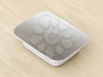 Plastic food container with silver lid on the wooden table