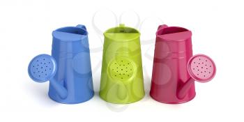 Three colorful watering cans on white background