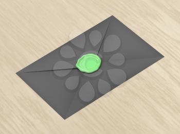 Black envelope sealed with green wax on wood table