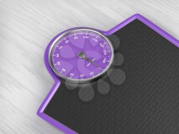 Purple weighing scale on wooden floor, close up