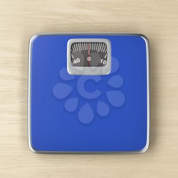 Analog weight scale on the wood floor, top view