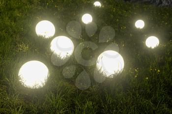 Glowing magic balls in the grass field, 3d rendering. Computer digital drawing.