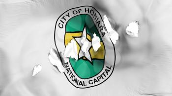 Honiara, capital of Solomon Islands flag perforated, bullet holes, white background, 3d rendering