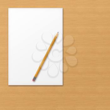 Sheet of office paper with yellow pencil on wooden background with soft shadows.  Above view.