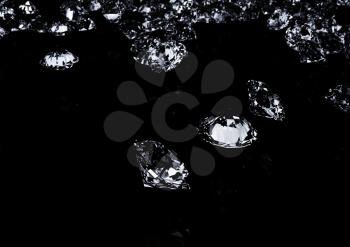 Diamonds on black background. 3D illustration.