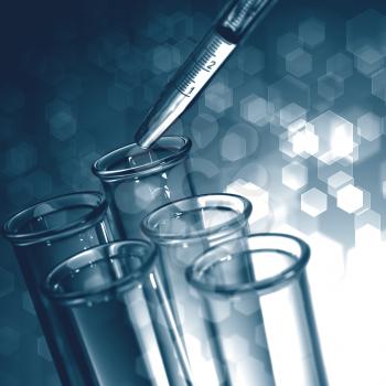 Chemical Background. Pipette Adding Fluid to One of Several Test Tubes.