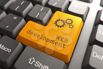 Orange Web Development Button on Computer Keyboard. Internet Concept.