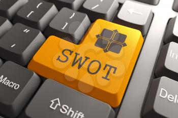 Orange SWOT Button on Computer Keyboard. Marketing Concept.