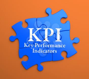KPI - Key Performance Indicators - Written on Blue Puzzle Pieces on Orange Background. Business Concept.