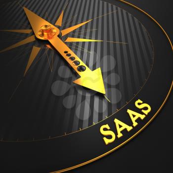 SAAS - Information Technology Concept. Golden Compass Needle on a Black Field Pointing to the Word SAAS. 3D Render.