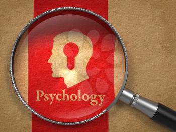 Psychology Concept: Magnifying Glass with Word Psychology and Icon of Head with a Keyhole on Old Paper with Red Vertical Line Background.
