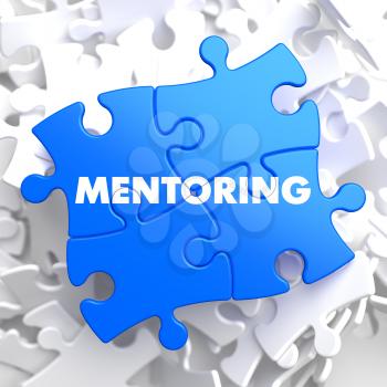Mentoring Writing on Blue Puzzle Pieces. Business Educational Concept.