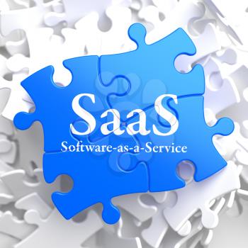 SAAS - Software-as-a-Service - Written on Blue Puzzle Pieces. Information Technology Concept. 3D Render.