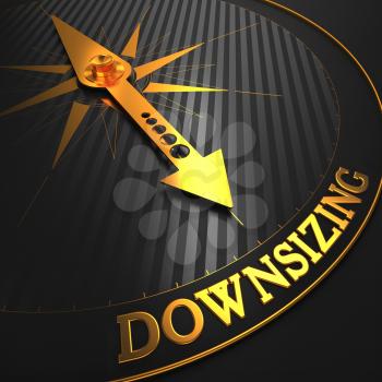 Downsizing - Business Concept. Golden Compass Needle on a Black Field Pointing to the Word Downsizing. 3D Render.