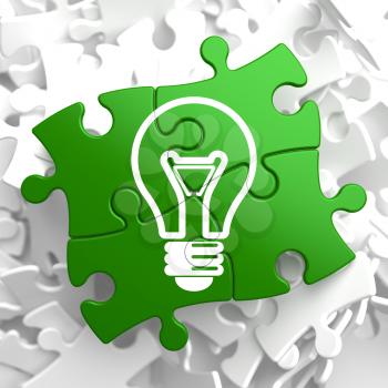Light Bulb Icon on Green Puzzle.  Idea Concept.