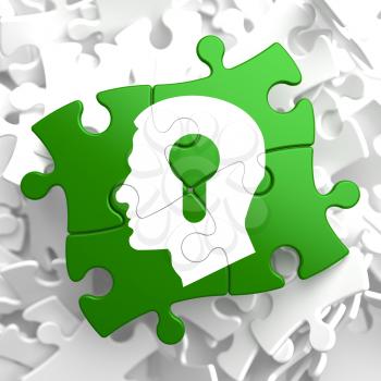 Psychological Concept - Profile of Head with a Keyhole Located on Green Puzzle Pieces.