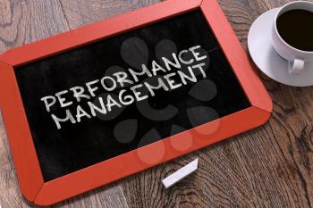 Handwritten Performance Management on a Red Chalkboard. Top View Composition with Chalkboard and White Cup of Coffee. 3d Render.