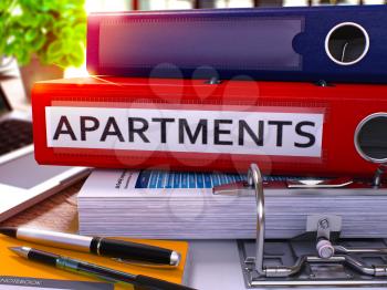 Red Office Folder with Inscription Apartments on Office Desktop with Office Supplies and Modern Laptop. Apartments Business Concept on Blurred Background. Apartments - Toned Image. 3D