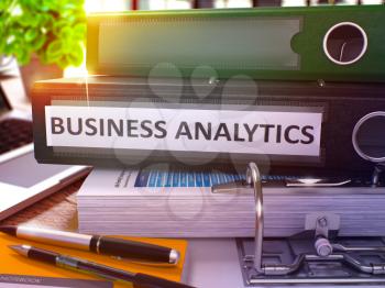Business Analytics - Black Office Folder on Background of Working Table with Stationery and Laptop. Business Analytics Business Concept on Blurred Background. Business Analytics Toned Image. 3D