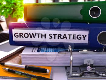Growth Strategy - Blue Ring Binder on Office Desktop with Office Supplies and Modern Laptop. Growth Strategy Business Concept on Blurred Background. Growth Strategy - Toned Illustration. 3D Render.