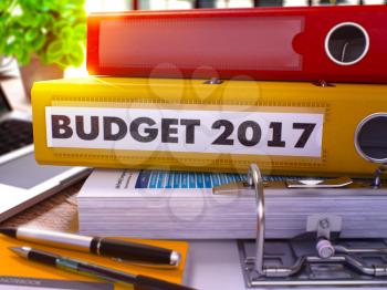 Yellow Office Folder with Inscription Budget 2017 on Office Desktop with Office Supplies and Modern Laptop. Budget 2017 Business Concept on Blurred Background. Budget 2017 - Toned Image. 3D