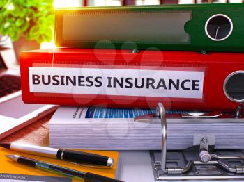 Red Office Folder with Inscription Business Insurance on Office Desktop with Office Supplies and Modern Laptop. Business Insurance Business Concept on Blurred Background. 3D Render
