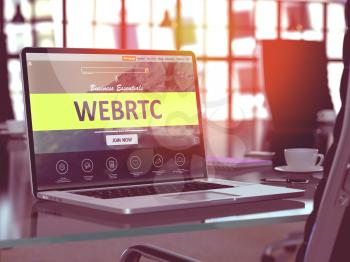 WEBRTC - Web Real Time Communication - Concept. Closeup Landing Page on Laptop Screen  on background of Comfortable Working Place in Modern Office. Blurred, Toned Image. 3D Render.