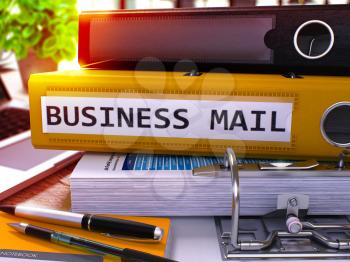 Yellow Office Folder with Inscription Business Mail on Office Desktop with Office Supplies and Modern Laptop. Business Mail Business Concept on Blurred Background. Business Mail - Toned Image. 3D.