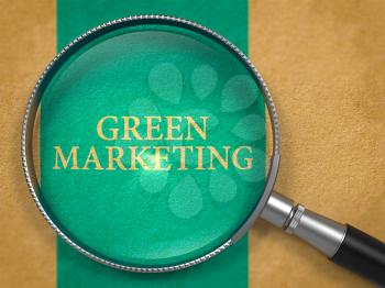 Green Marketing Concept through Magnifier on Old Paper with Blue Vertical Line Background. 3D Render.